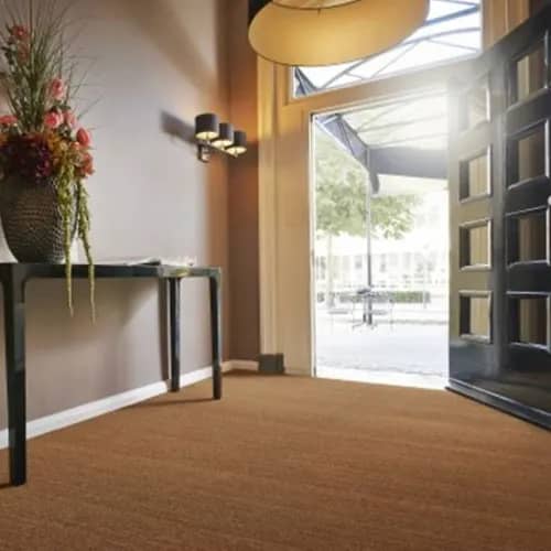Poona Natural installed wall-to-wall in entry way