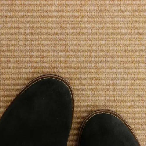 Detail of Middlesex Wheat polypropylene-wool carpet with bouclé structure.