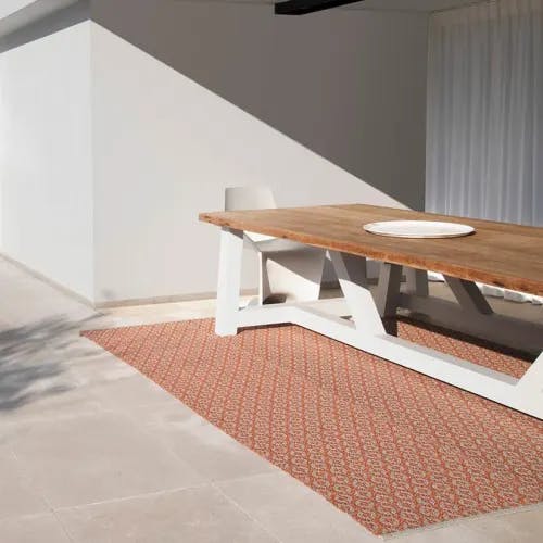 stylish foundation: a terrazza synthetic outdoor rug looks fantastic on patios, pool decks, & under dining tables (color flame)
