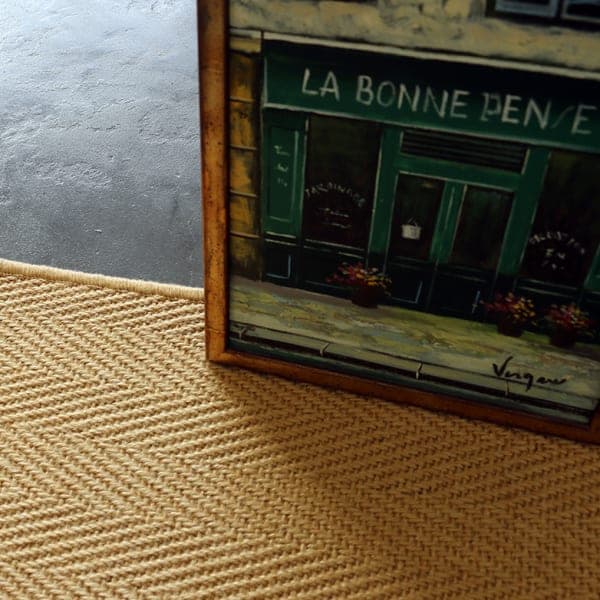 Granada Natural jute rug with herringbone pattern and serged border