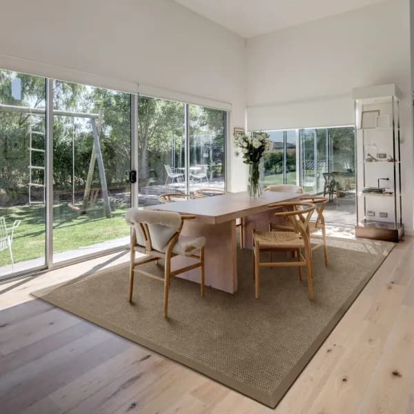 Cottage Bark area rug with cloth border in Scandinavian style dining room