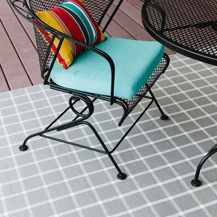 Sandpoint Silver Plaid outdoor area rug on deck