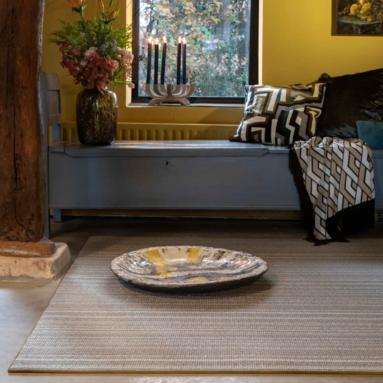 Masai Nude wool rug with blind soft border in rustic room