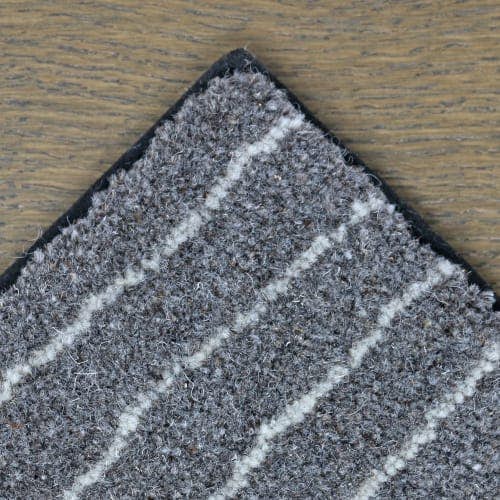 Chalk Route wool rug with blind soft black border