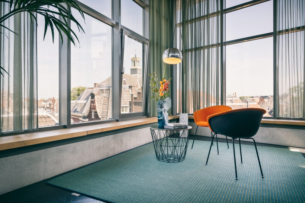 Flashback Moss luxury wool rug in modern office setting